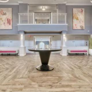 A modern and spacious lobby with elegant decor and stylish furniture.