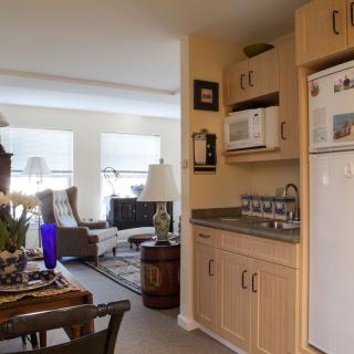 Cozy living and kitchen area with modern appliances and comfortable seating.