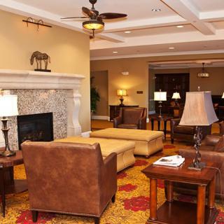 A cozy living room with a fireplace and comfortable seating.