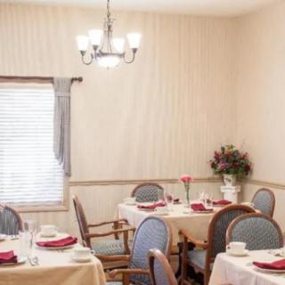 A cozy dining room with neatly arranged tables and elegant decor.