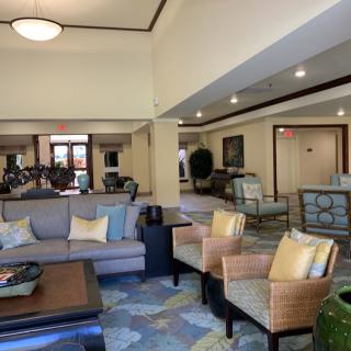 A modern lobby interior featuring comfortable seating and stylish decor.