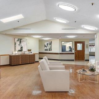 A modern waiting room with comfortable seating and stylish decor.