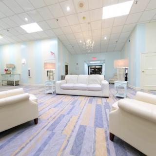 A modern lobby with comfortable seating arrangements and stylish lighting.