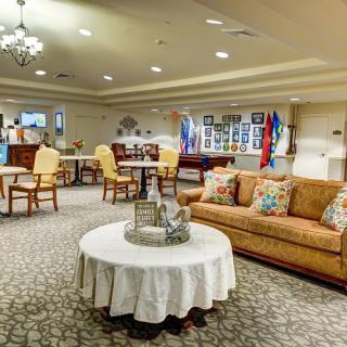 A cozy and well-decorated living room with elegant furniture and ambient lighting.