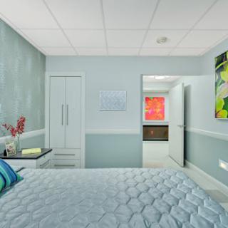 A modern and inviting bedroom featuring soothing colors and contemporary decor.
