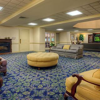 A spacious and elegantly decorated lobby with comfortable seating.