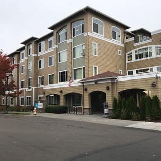 A multi-story residential building with a modern design.