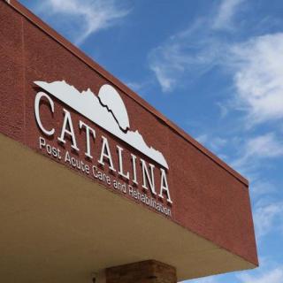 A building with a sign that reads 'Catalina' against a clear blue sky.