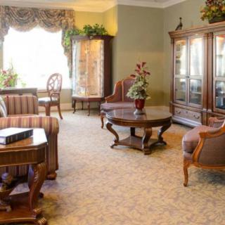 A traditional living room with elegant furniture and decor.