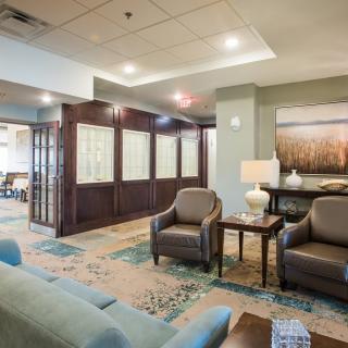 A cozy lobby interior featuring comfortable seating and elegant decor.