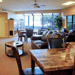 A cozy living room with comfortable seating and large windows.