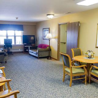 A spacious living room with comfortable seating and entertainment options.