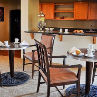 Cozy cafe interior with tables and chairs set for breakfast.