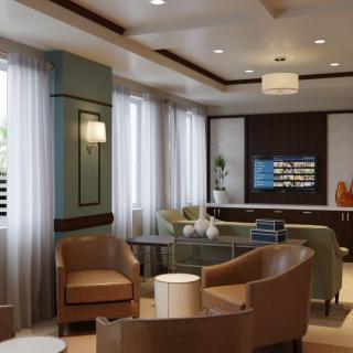 A modern living room featuring comfortable seating, stylish furniture, and ample natural light.