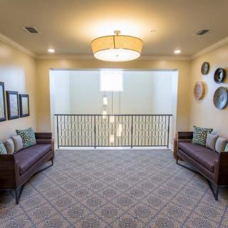 A cozy hallway with elegant seating and modern decor.