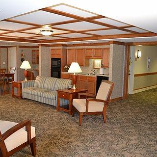 A cozy living room with comfortable seating and warm wooden accents.