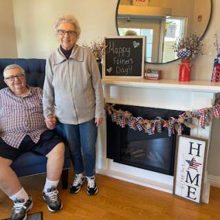 A loving couple enjoying their time together in a cozy home setting.
