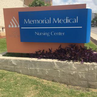 Sign for Memorial Medical Nursing Center outside a building.