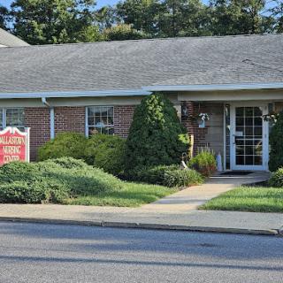 A well-maintained office building with lush landscaping and a clear entrance path.