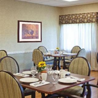 A neatly arranged dining room with tables set for service.