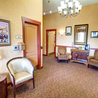 Cozy waiting room with comfortable chairs and elegant decor.