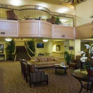 A spacious hotel lobby with comfortable seating and elegant decor.