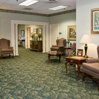 A cozy waiting room with comfortable chairs and elegant decor.