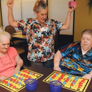 Seniors enjoying a lively game of bingo at a care facility.
