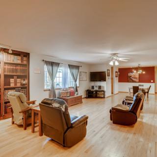 Spacious living room with comfortable seating and a dining area.