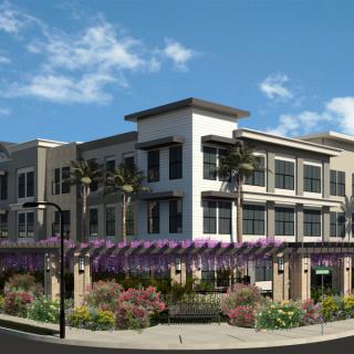 Modern commercial building with landscaped surroundings.