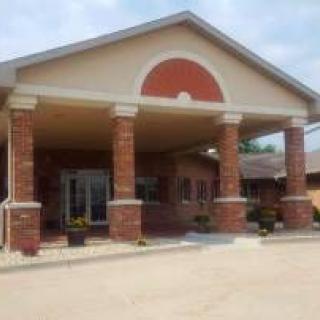 A building entrance with brick columns and a covered porch.