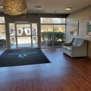 A welcoming lobby area featuring modern furniture and ample natural light.