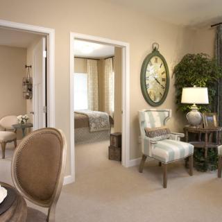 A cozy living room space with elegant decor and comfortable seating.