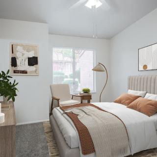 A beautifully designed modern bedroom featuring a cozy atmosphere with natural light.