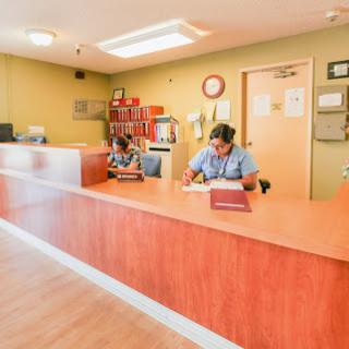 A busy reception area with staff attending to their tasks.