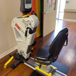 A rowing machine set up for use in a fitness or rehabilitation space.