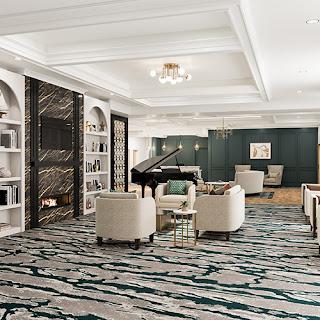 A stylish and sophisticated lounge area featuring a grand piano, elegant seating, and contemporary decor.