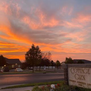 A beautiful sunset paints the sky in vibrant hues, marking the transition from day to night.