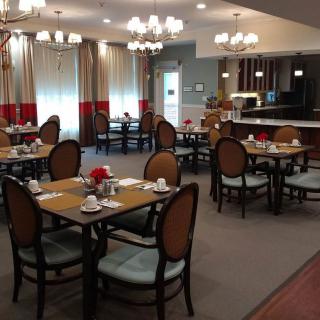 A cozy restaurant dining area with tables set for service.