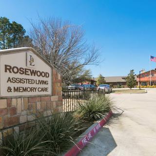 Entrance to the Rosewood Assisted Living and Memory Care facility on a clear day.
