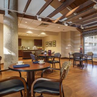 A cozy indoor dining area with neatly arranged tables and chairs.