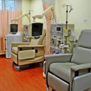 A room equipped with dialysis machines and comfortable chairs for patients.
