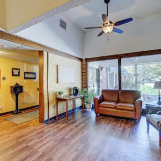 A bright and inviting living room featuring comfortable seating and ample natural light.