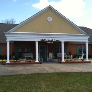 A welcoming entrance to a commercial building featuring classic architectural elements.