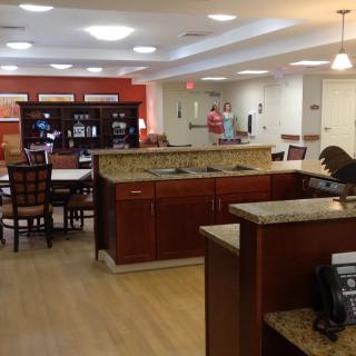 A spacious community dining area with a warm and welcoming atmosphere.