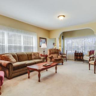 A cozy living room with comfortable seating and large windows.