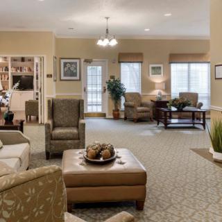 A cozy and well-lit living room with comfortable seating and stylish decor.