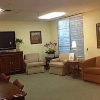 A cozy living room with comfortable seating, a television, and decorative elements.