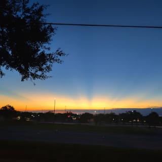 A serene sunset casting vibrant colors across the sky.