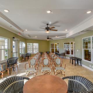 A spacious lounge area with elegant furniture and large windows, perfect for gatherings.